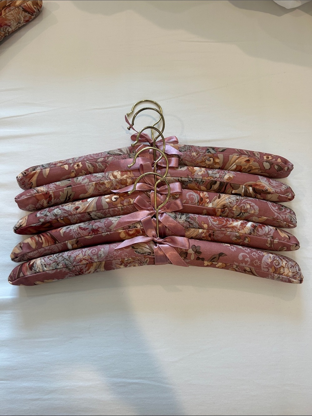 Set of 5 Soft Floral Padded Hangers in Pink and Warm Rose Tones.